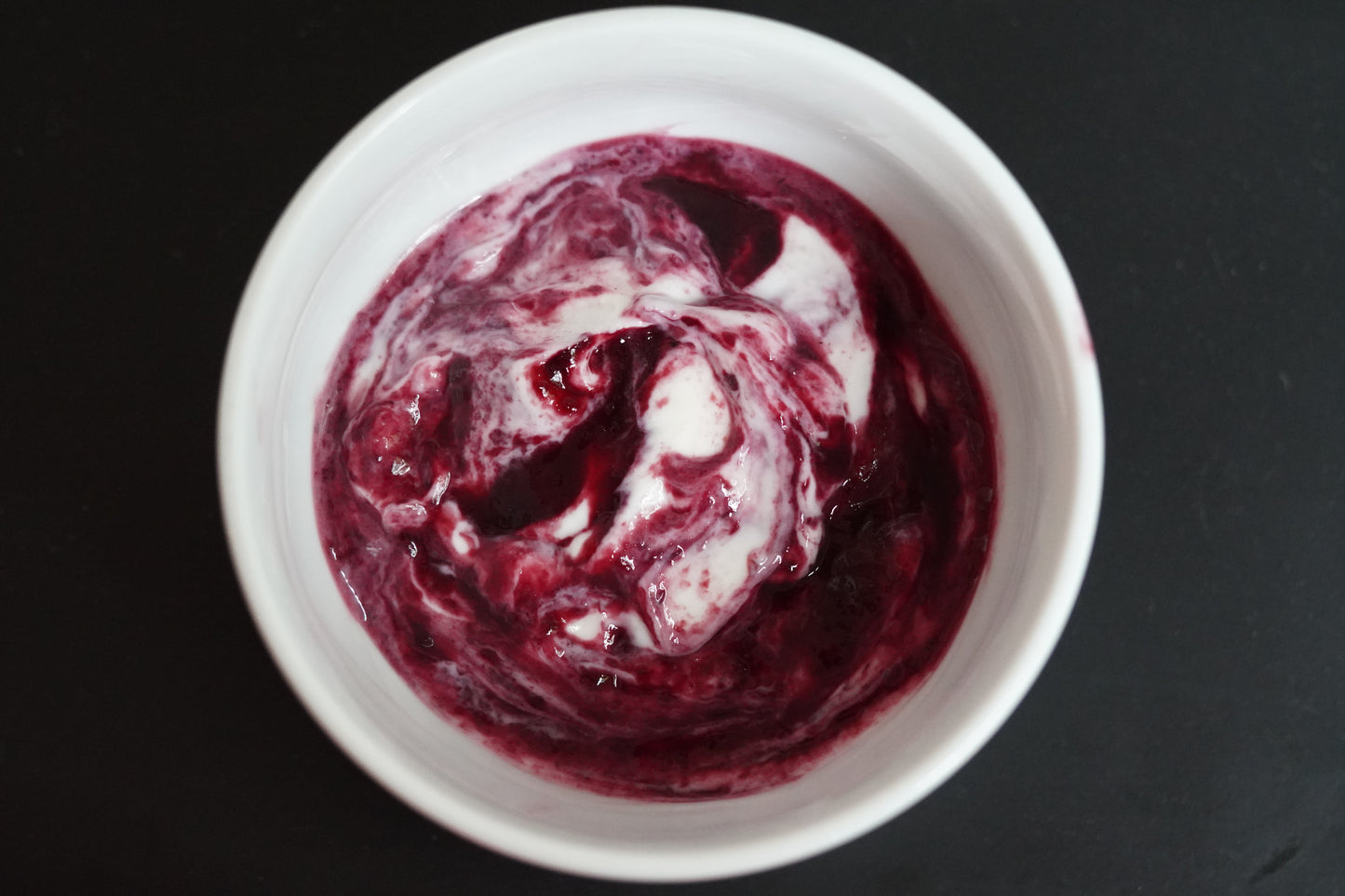 Bowl of greek yogurt with Blackberry Bramble swirled in