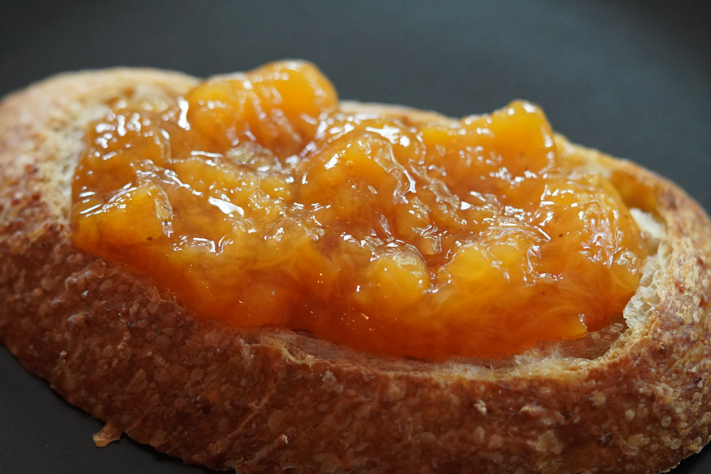 Peach Old Fashioned piled high on a slice of Sourdough Bread